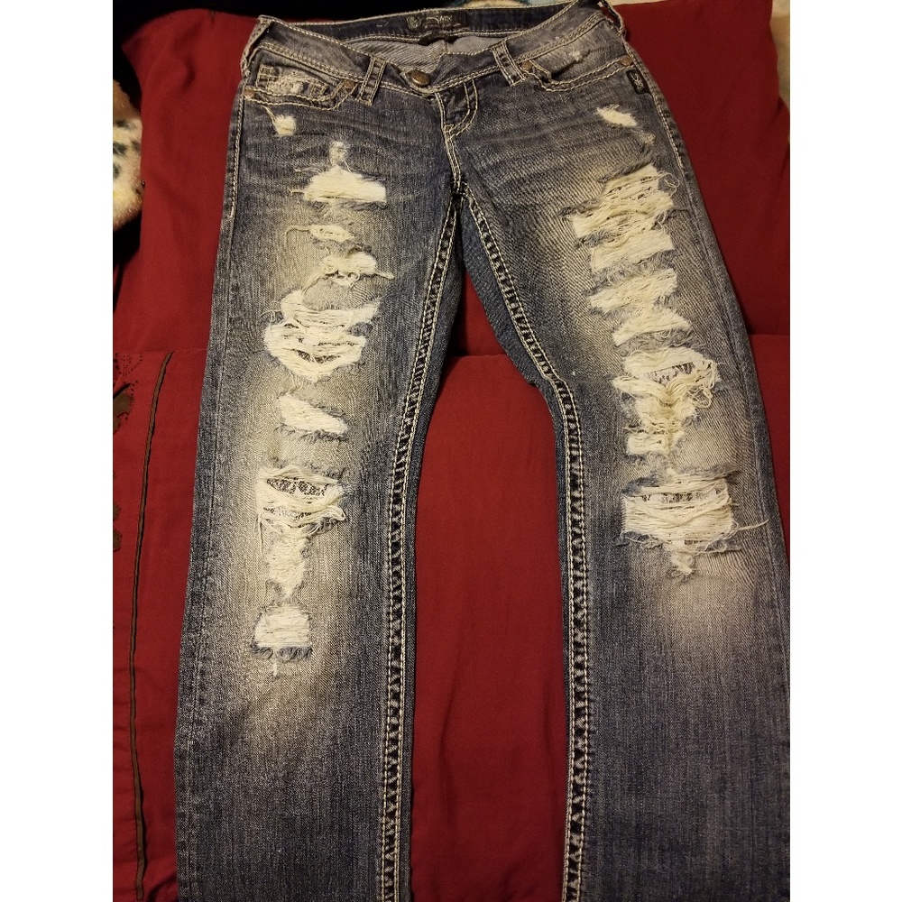 Distressed jeans.